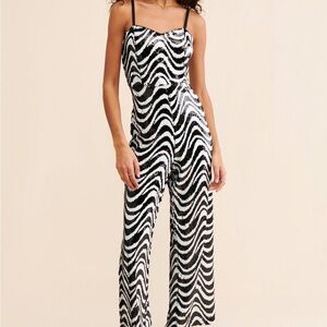 Chic Black and White Zebra Print Jumpsuit with Flowing Wide Legs
